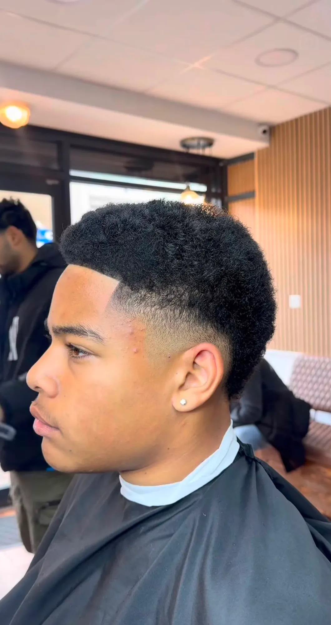 Men's afro with a taper fade