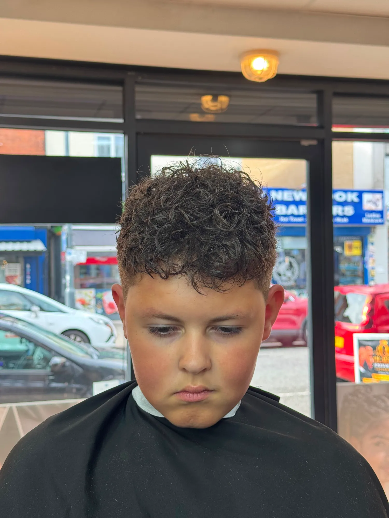 Boy's curly crop with a taper