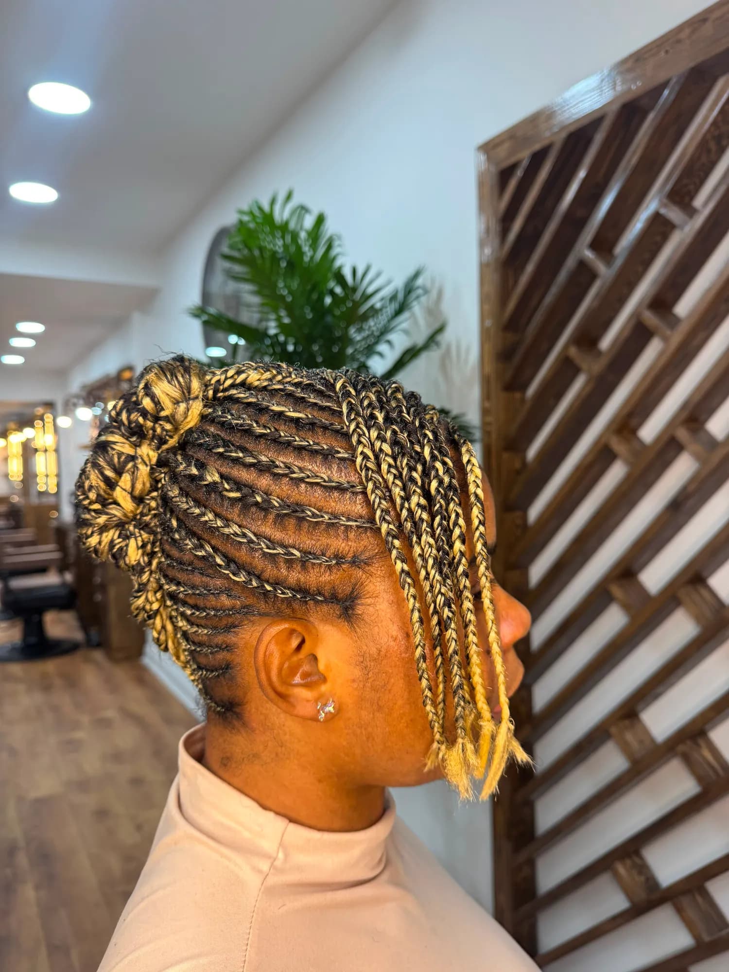 Blonde flat-twist updo with braided lengths