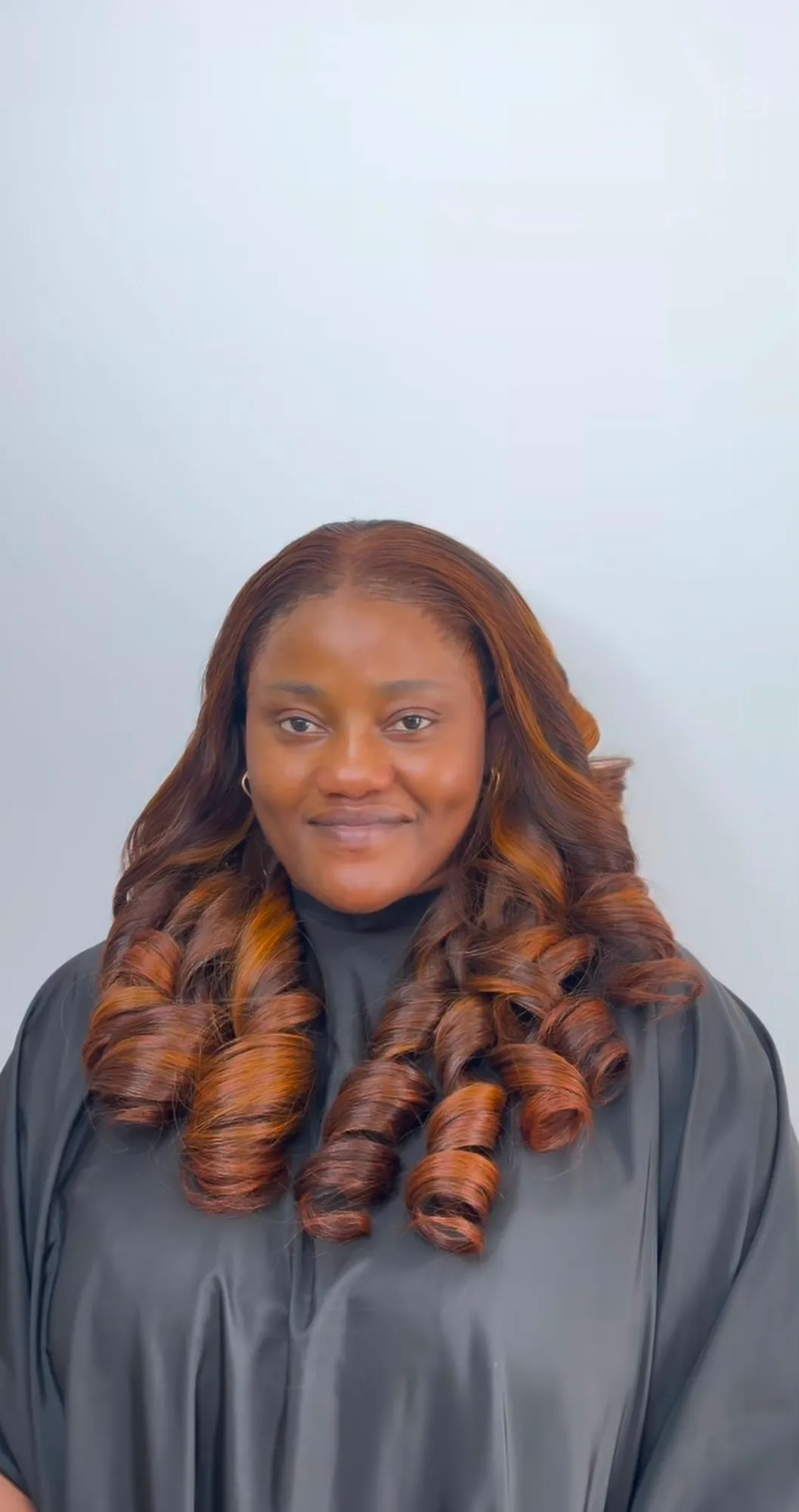 Copper-auburn curled blowout