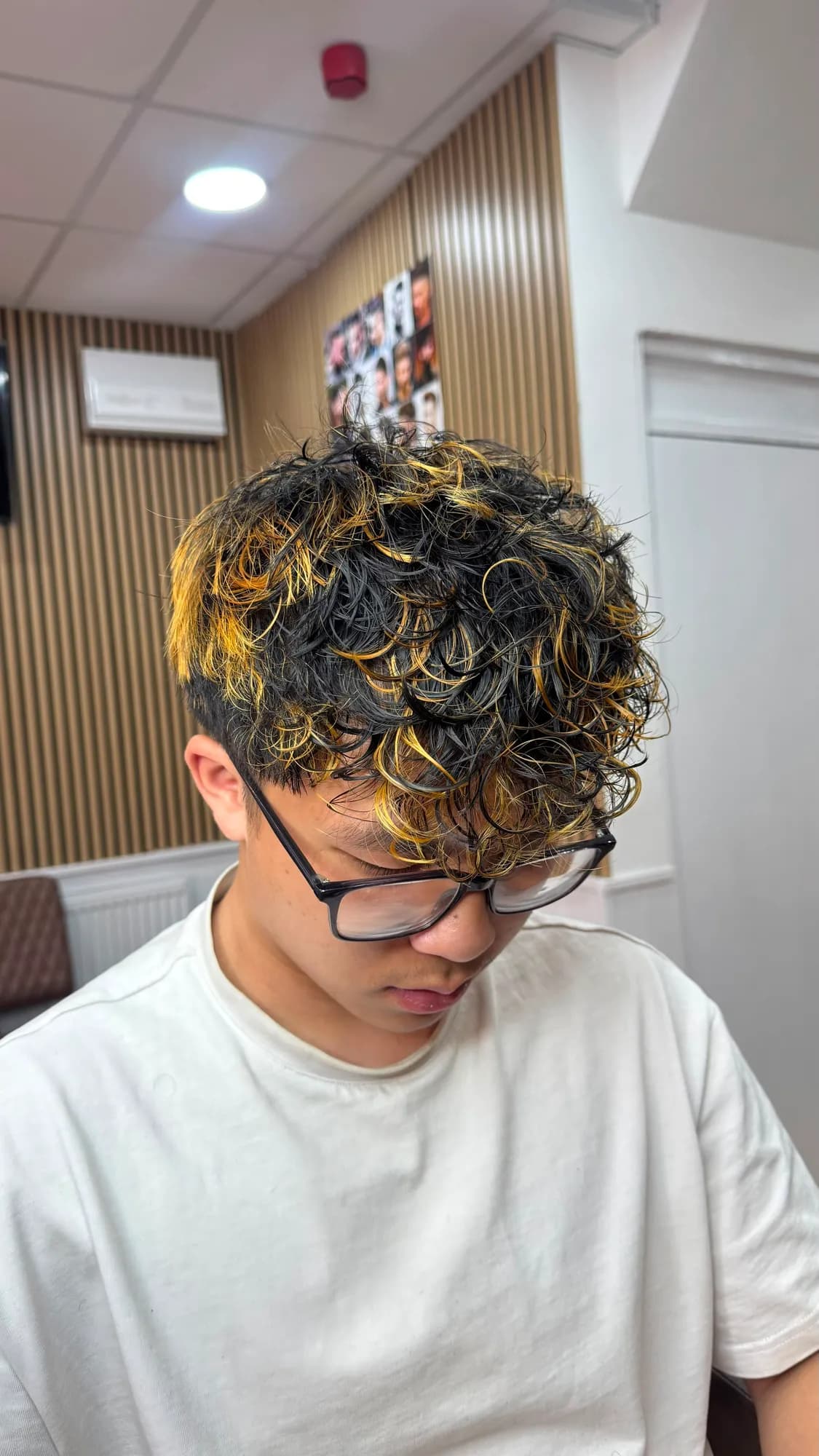 Men's perm with gold highlights, top view